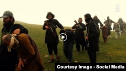 Grab from a video that shows militants loyal to the Islamic State (IS) blowing up bound and blindfolded Afghan prisoners with explosives. The victims were from Nangarhar province.