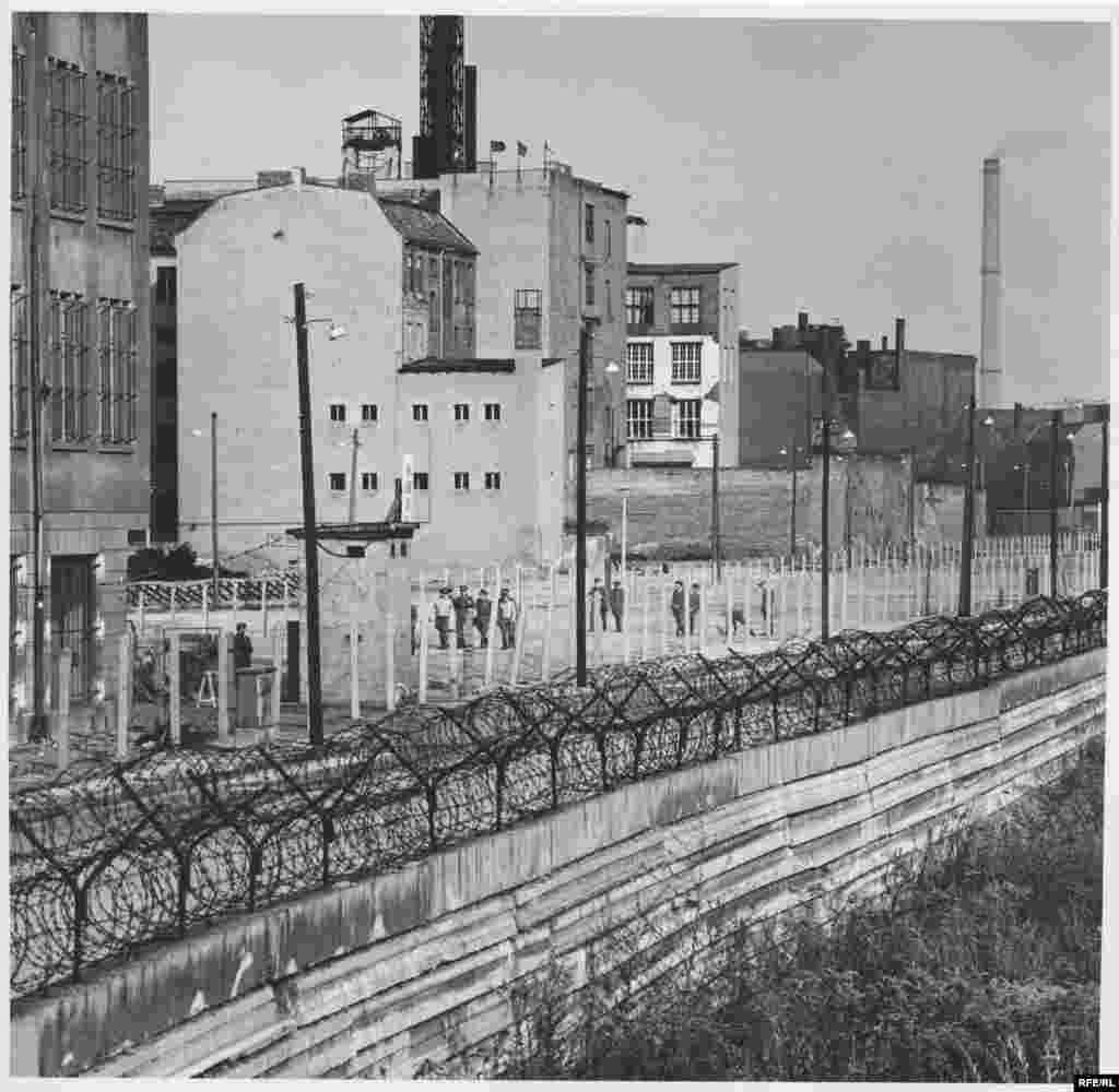 A section of the wall - On August 17, 1962, 18-year-old Peter Fechter bled to death in the no-man's land between East and West Berlin after being shot trying to escape. Western cameramen recorded the scene for nearly an hour before guards took away his body.