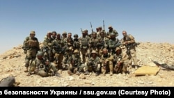 Иллюстрация: "Вагнер" ЧВКсынын Сириядагы жалданма аскерлери, Украинанын коопсуздук кызматы тараткан сүрөт.