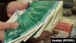 Кыргызстандын улуттук валютасы. Иллюстрациялык сүрөт.