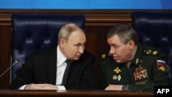 Russian President Vladimir Putin and Chief of the General Staff Valery Gerasimov at a Russian Defense Ministry meeting in Moscow on December 17