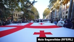 Грузиянын туусун көтөргөндөр.
