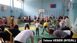 Караганды шаарында өткөн "Аутизмди жеңебиз" деген иш-чарадан тартылган сүрөт. 