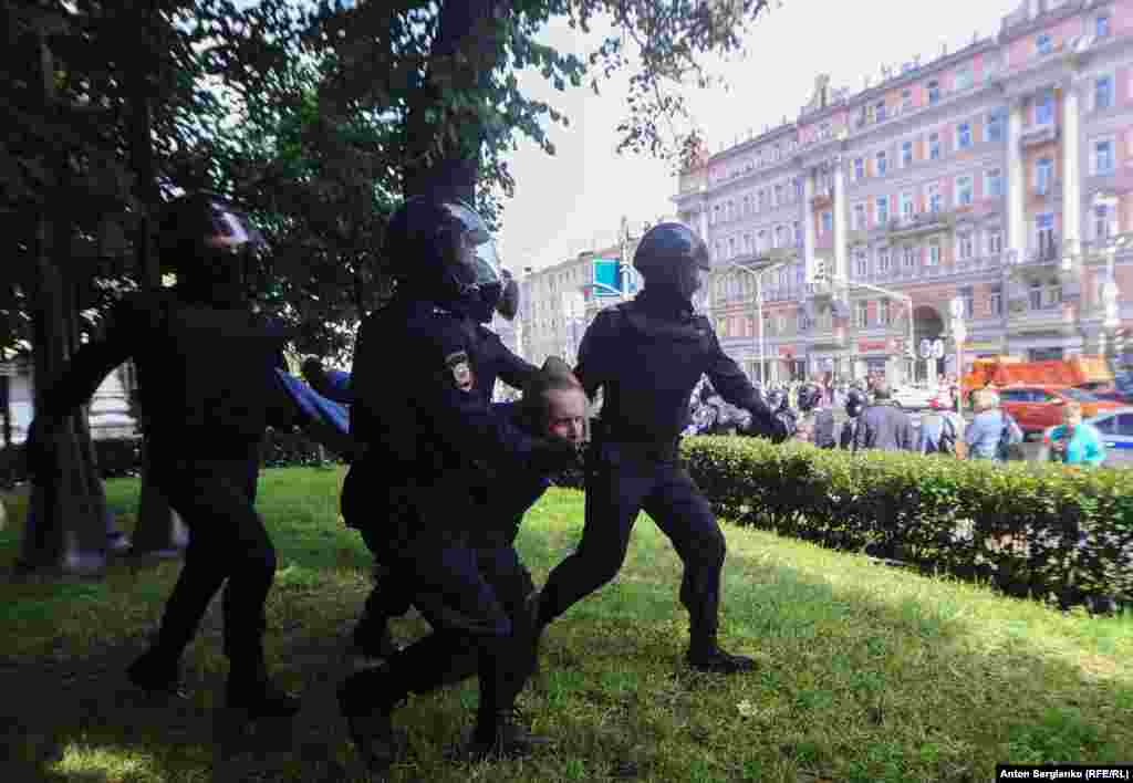 Police swooped on another demonstrator. RFE/RL's Moscow correspondent Matthew Luxmoore said it felt like a state of emergency had been declared in Moscow.